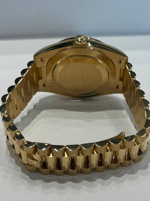 Rolex | Day-Date | 228348RBR | Yellow gold | 40 mm | Yellow gold | Black | Automatic